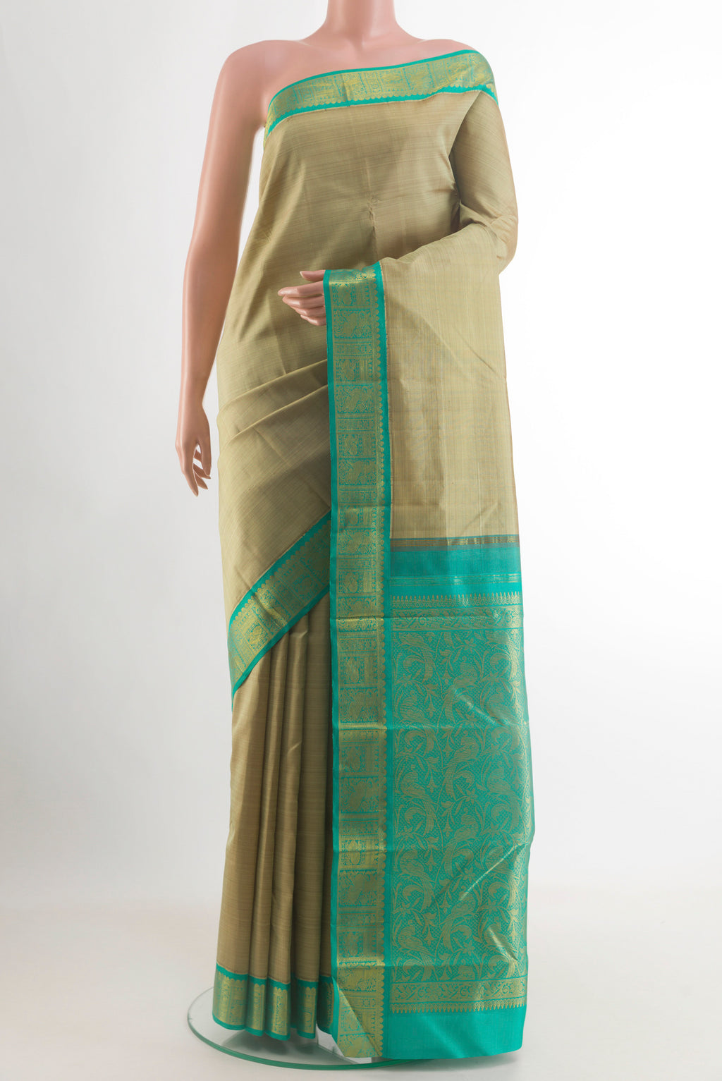 Beige Kanjivaram Silk Saree with Plain Body and Zari Border.  displayed on a mannequin