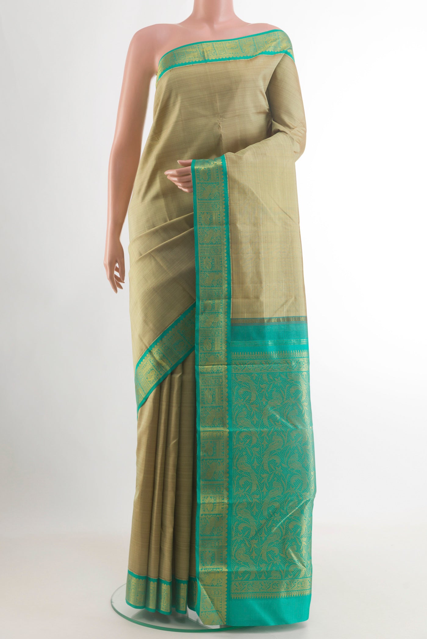 Beige Kanjivaram Silk Saree with Plain Body and Zari Border.  displayed on a mannequin