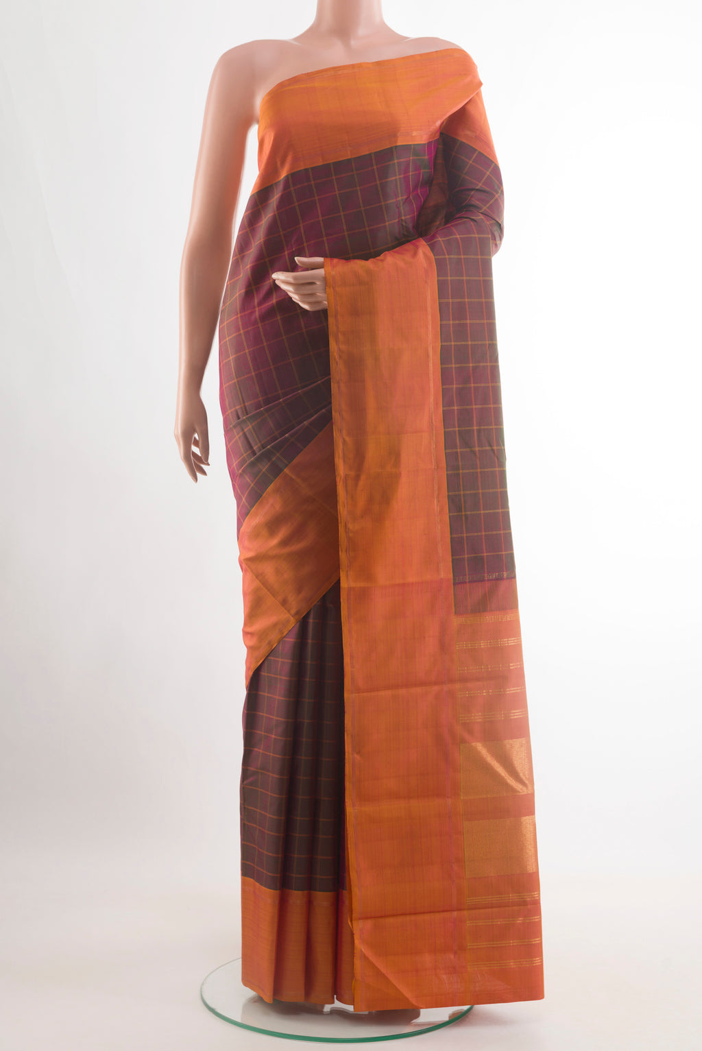 Multi Color Kanjivaram Silk Saree with Checked design on the body and Plain Border.  displayed on a mannequin