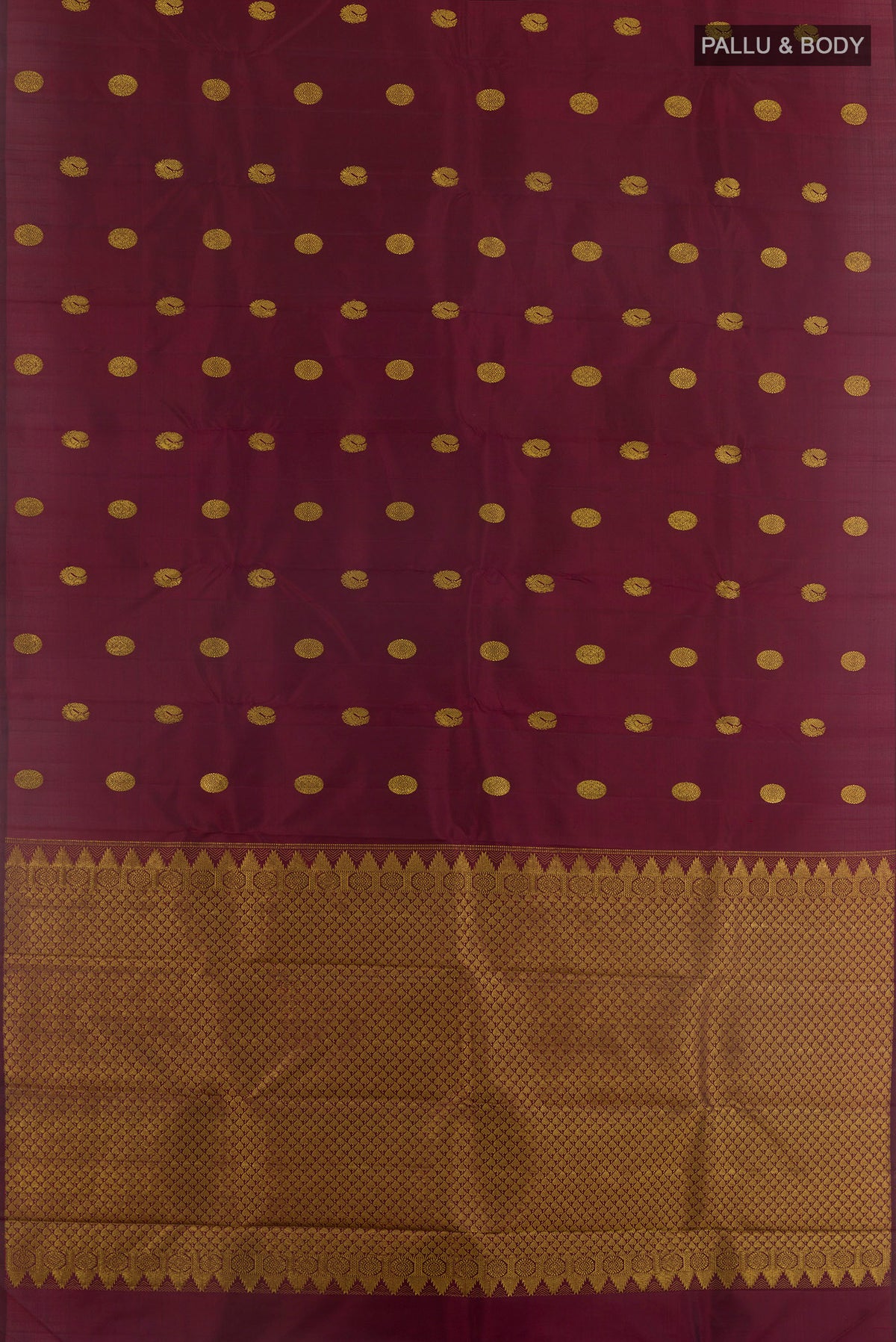 Flat view of Maroon Kanchipuram Silk Saree with Zari Butta on the body and Without Border. 