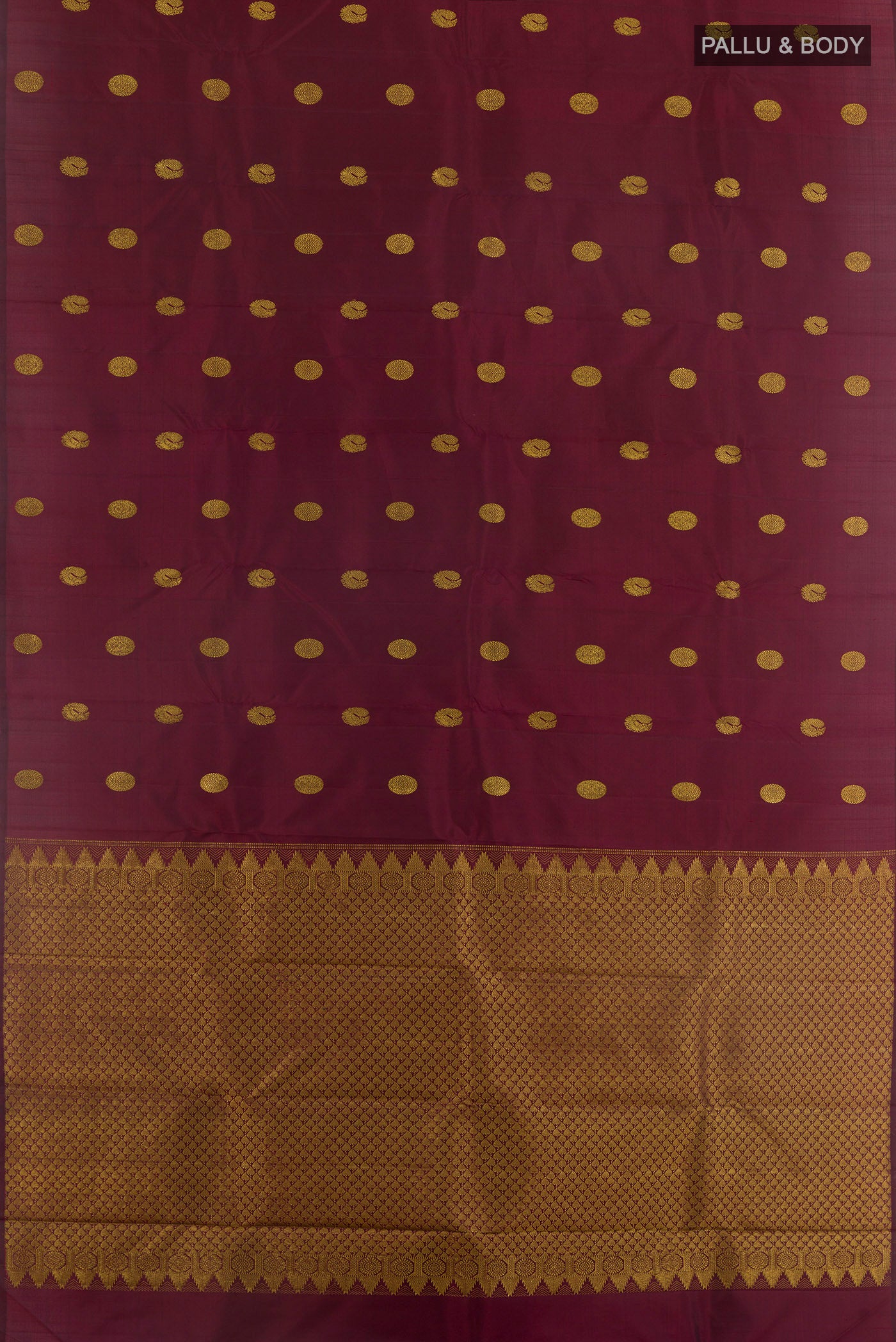 Flat view of Maroon Kanchipuram Silk Saree with Zari Butta on the body and Without Border. 