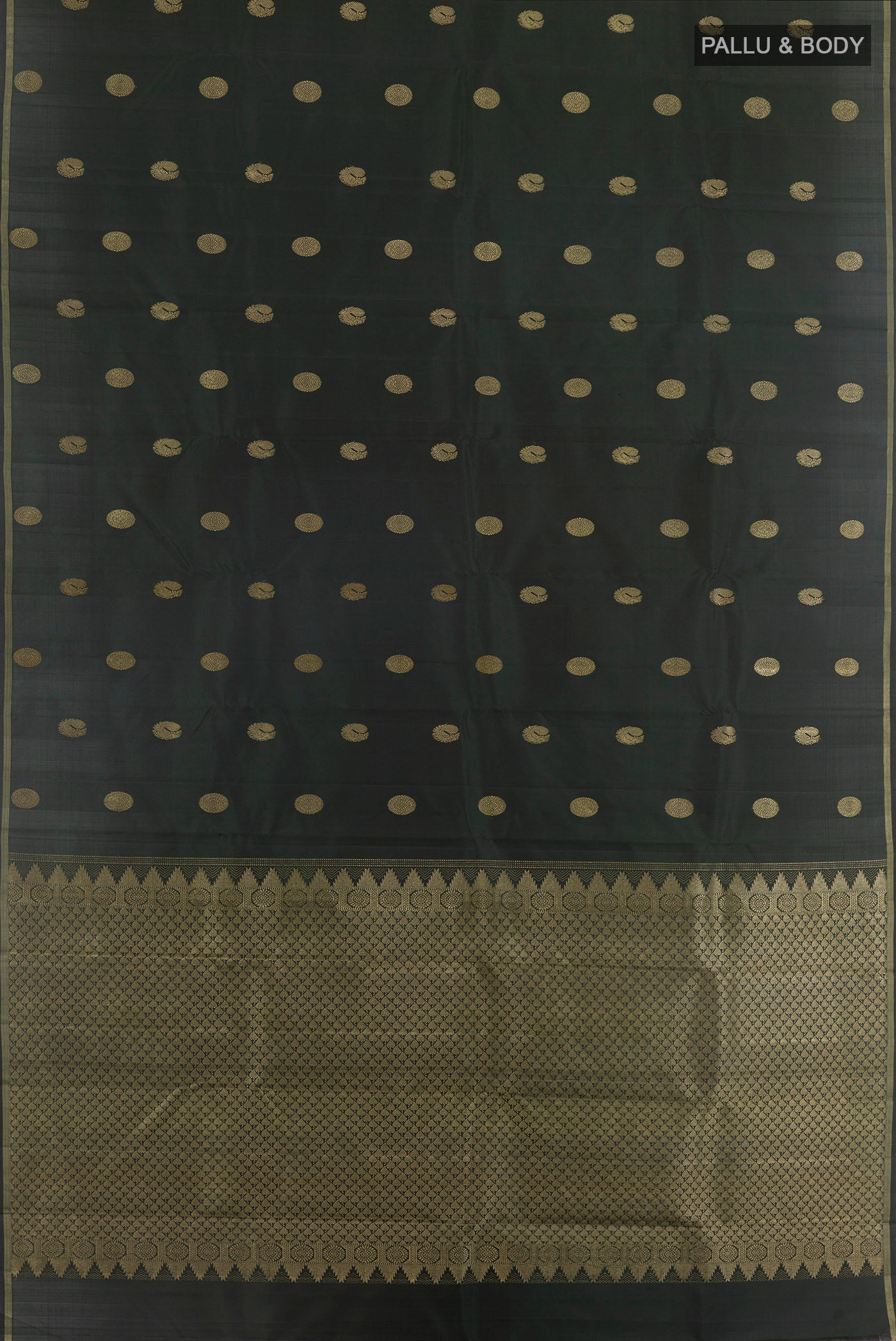 Flat view of Bottle Green Kanchipuram Silk Saree with Zari Butta on the body and Zari Border. 