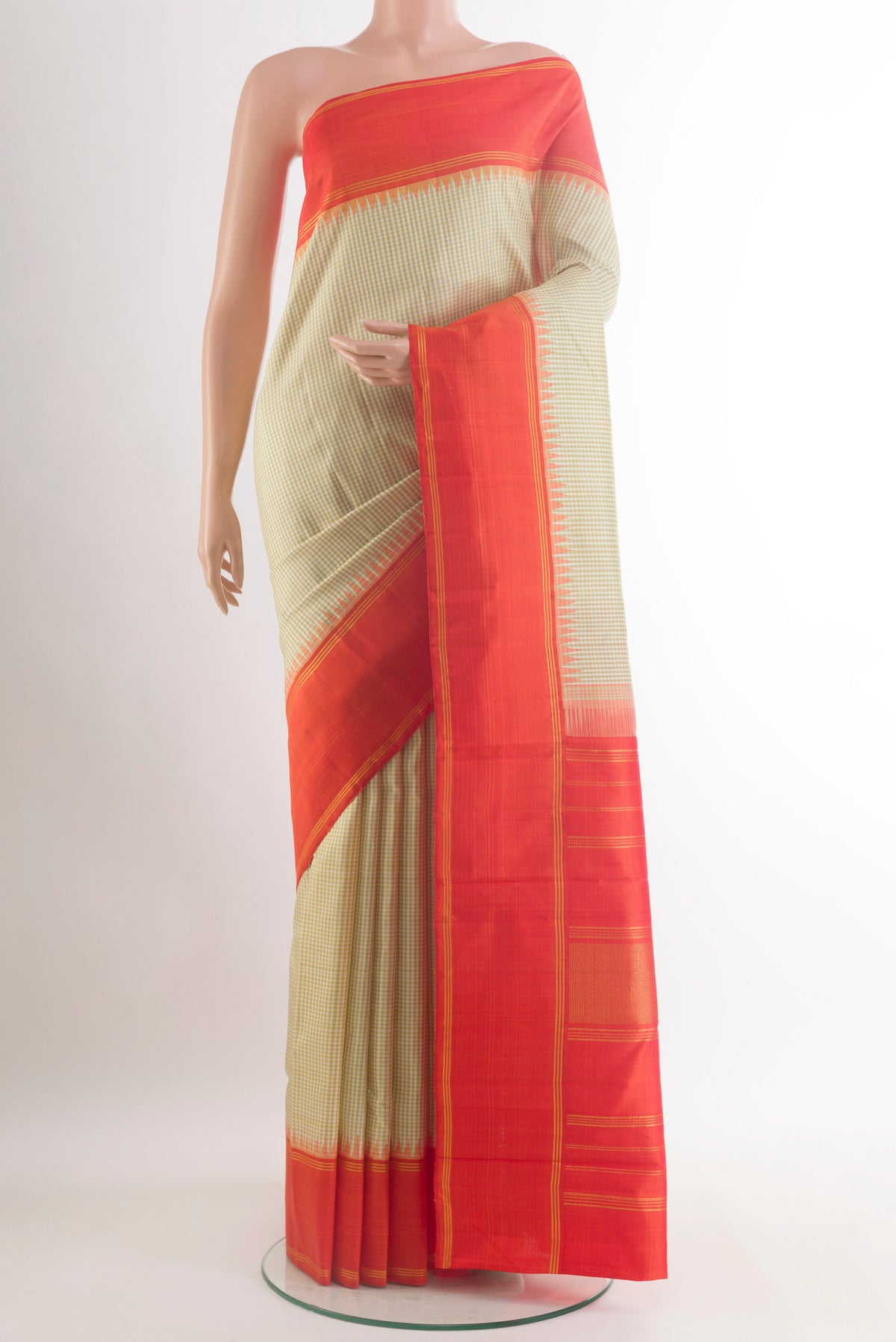 Pure Silk Cream Kanjivaram Saree with Checked design on the body and Plain Border.  displayed on a mannequin