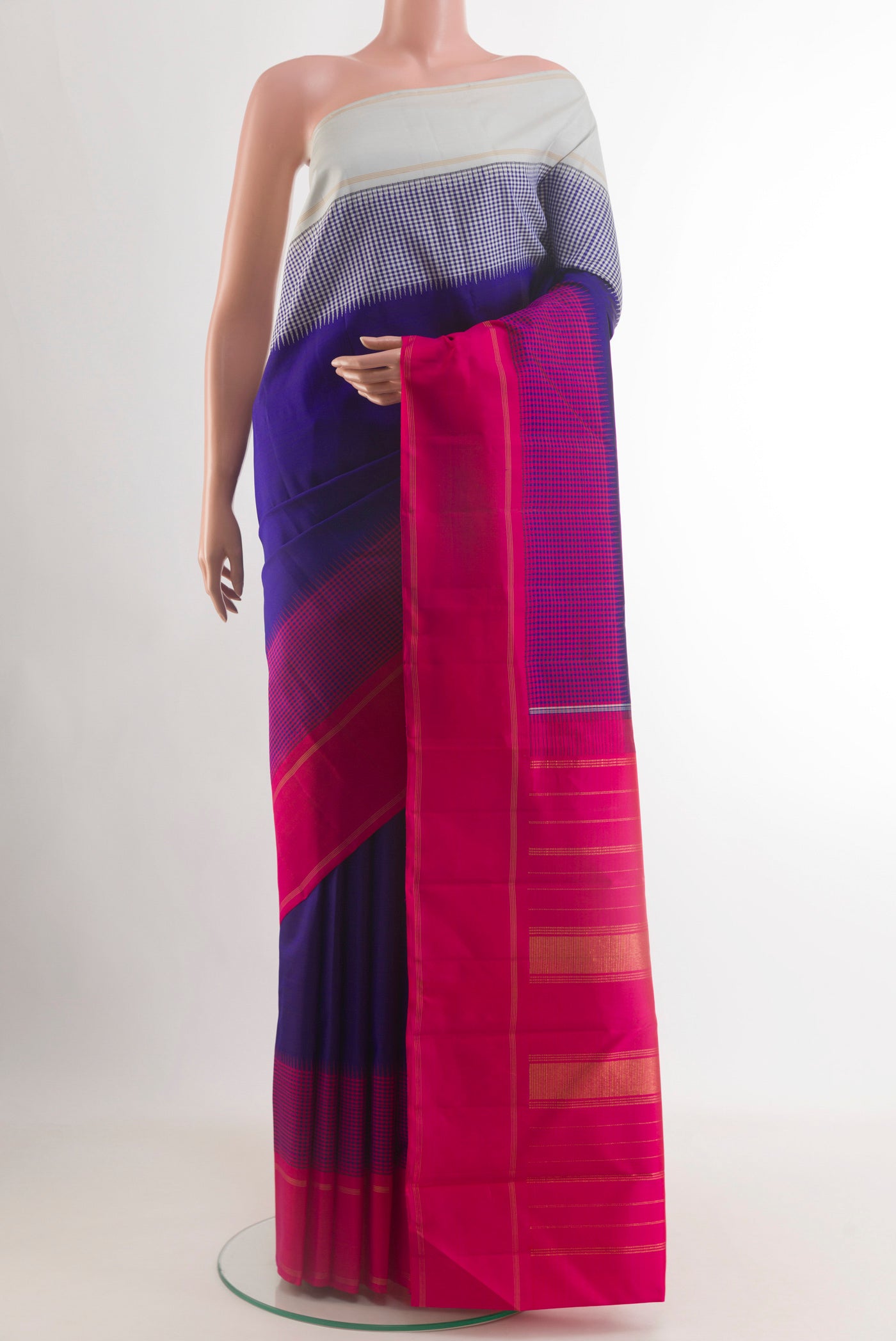 Blue Kanjivaram Silk Saree with Plain Body and Ganga Jamuna Border.  displayed on a mannequin