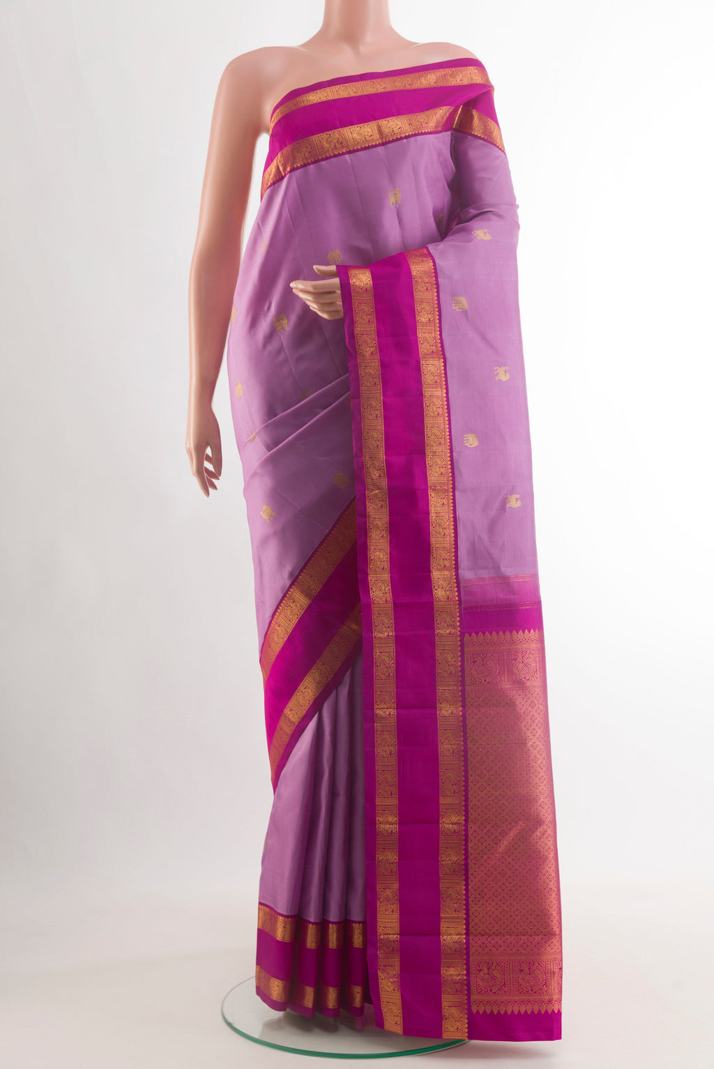 Lavender Kanjivaram Silk Saree with Zari Butta on the body and Zari Border.  displayed on a mannequin