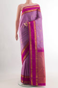 Lavender Kanjivaram Silk Saree with Zari Butta on the body and Zari Border.  displayed on a mannequin