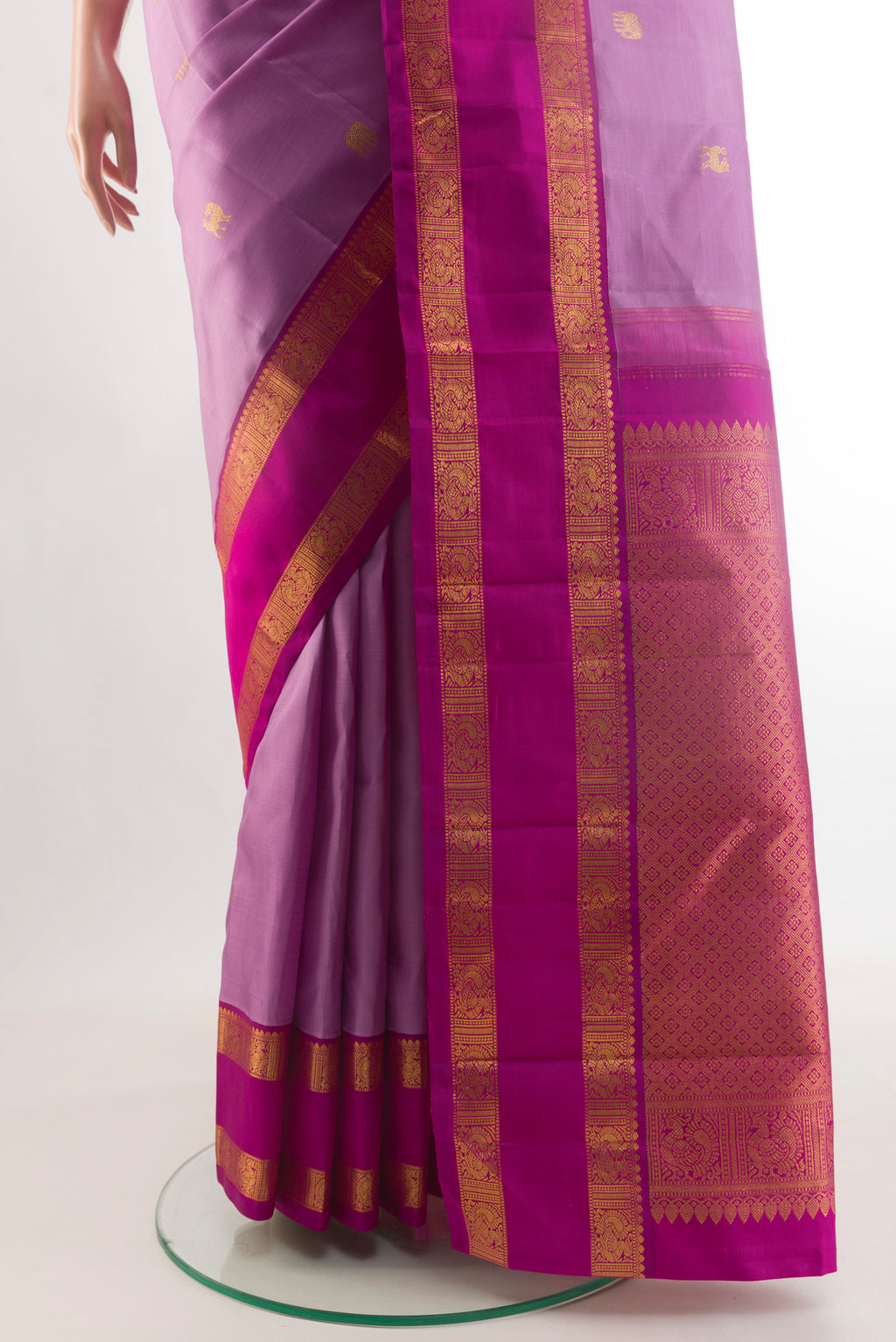 Pleats and pallu of Lavender Kanjivaram Silk Saree with Zari Butta on the body and Zari Border. 