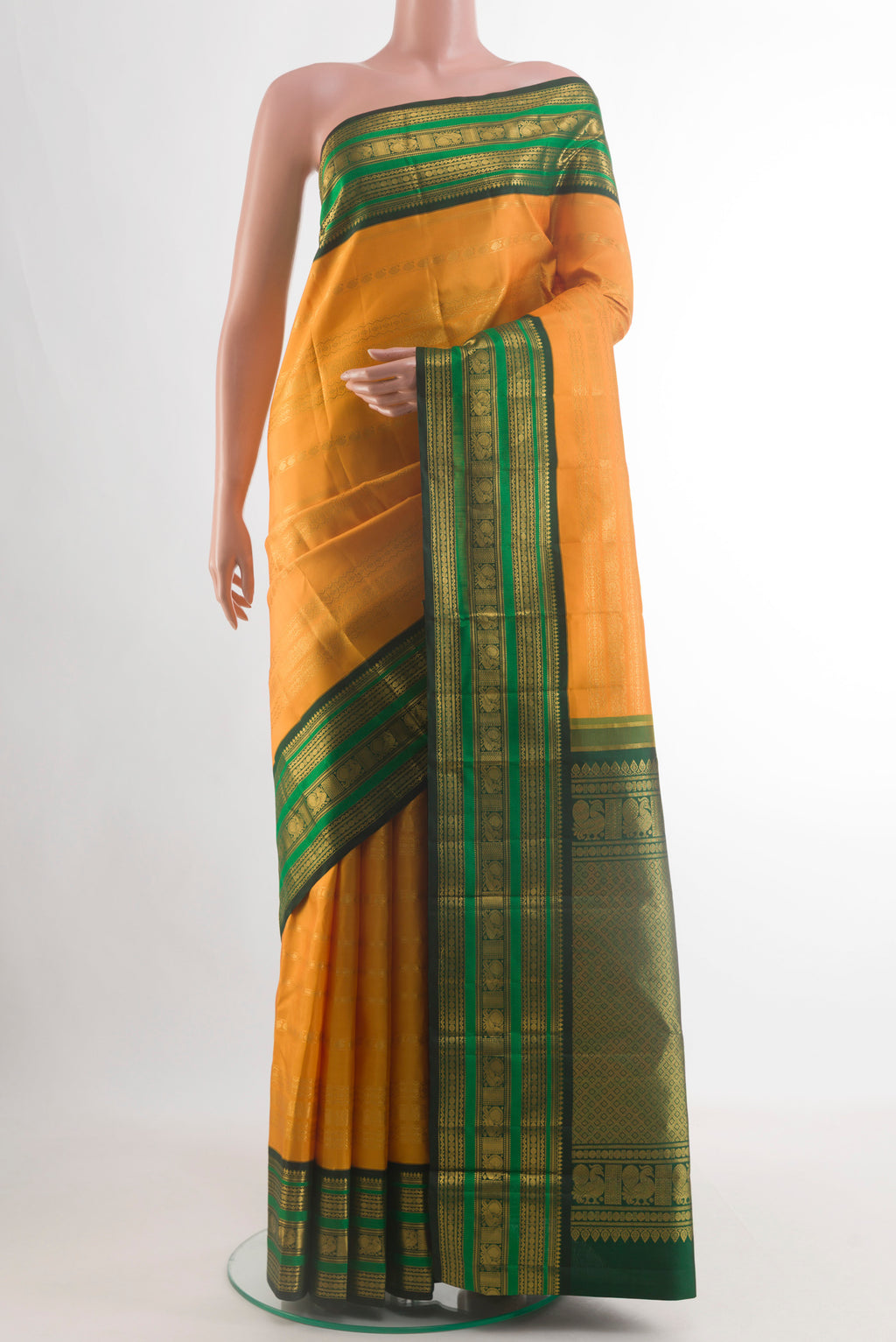 Yellow Kanchipuram Silk Saree with Stripes on the body and Zari Border.  displayed on a mannequin