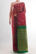 Maroon Kanjivaram Silk Saree with Zari Brocade on the body and Zari Border.  displayed on a mannequin