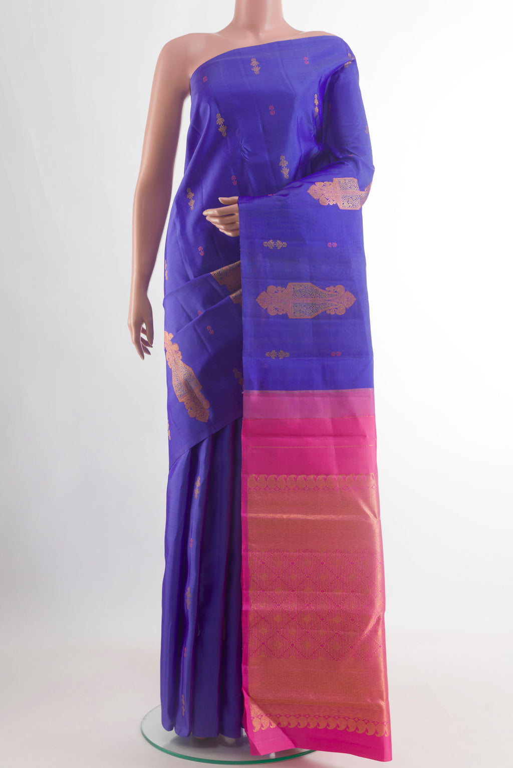 Royal Blue Kanjivaram Silk Saree with Zari Butta on the body and Without Border.  displayed on a mannequin