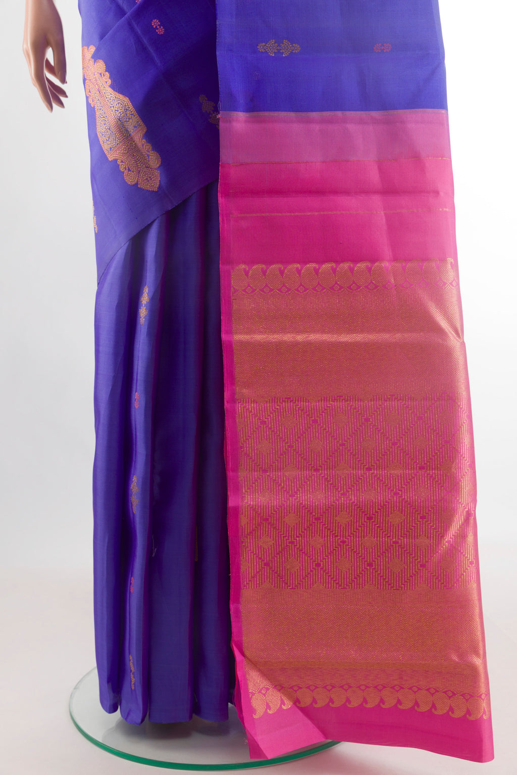 Pleats and pallu of Royal Blue Kanjivaram Silk Saree with Zari Butta on the body and Without Border. 