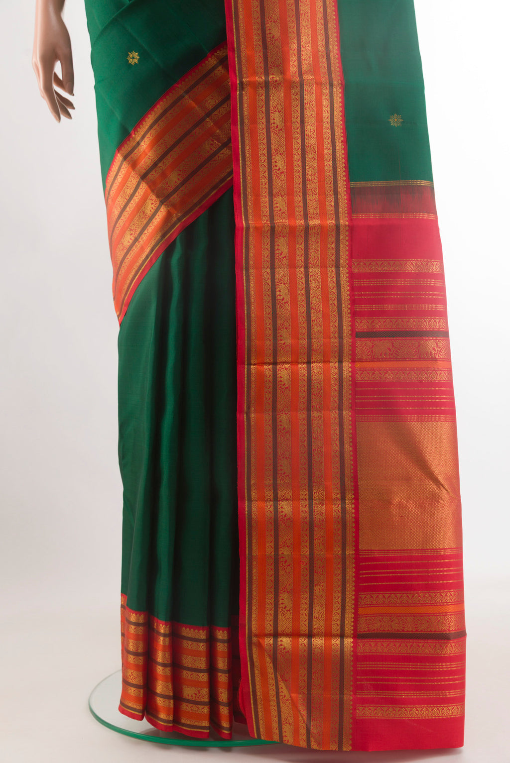 Pleats and pallu of Bottle Green Kanjivaram Silk Saree with Zari Butta on the body and Zari Border. 