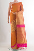 Mustard Kanjivaram Tissue Saree with Plain Body and Temple Border.  displayed on a mannequin