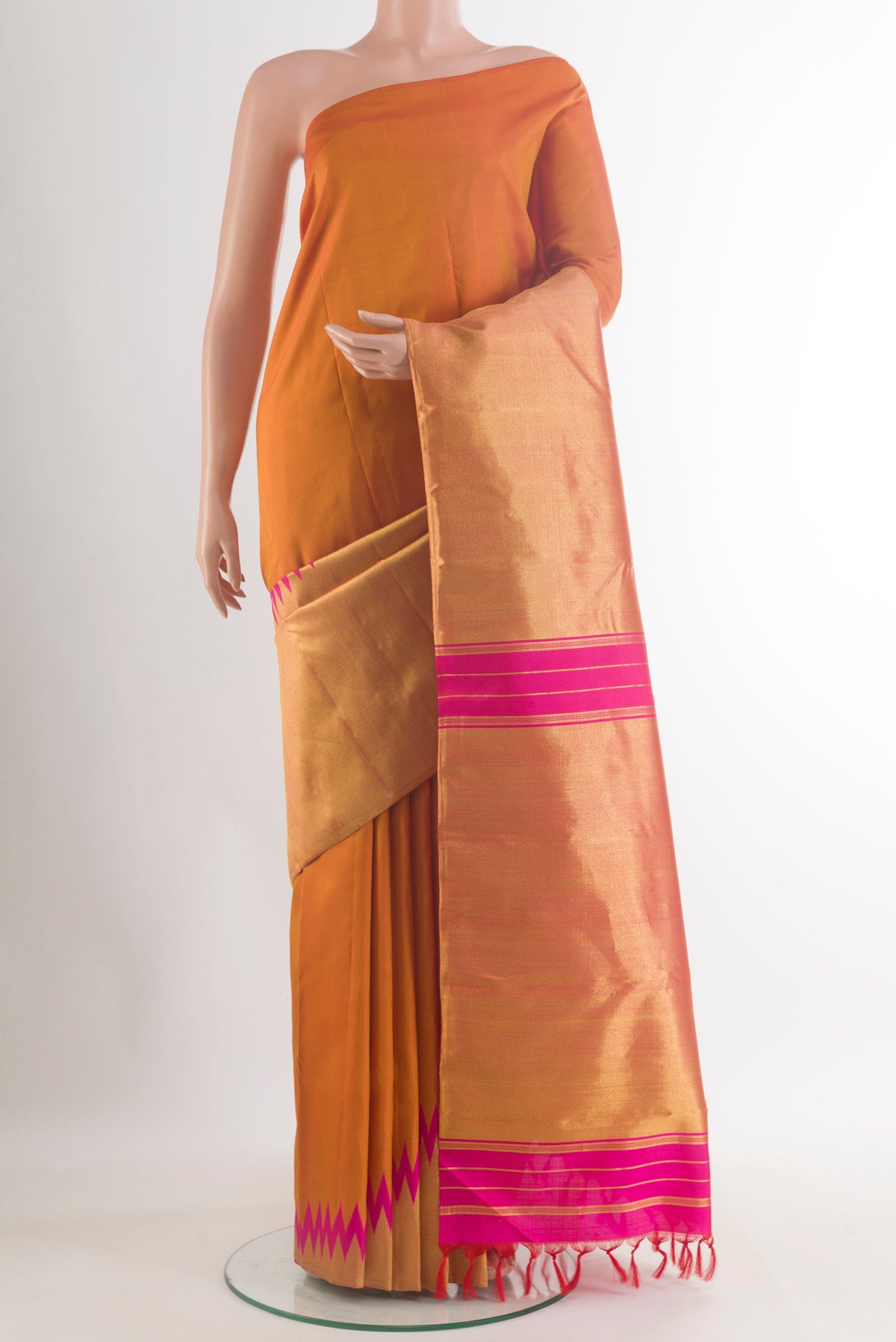 Mustard Kanjivaram Tissue Saree with Plain Body and Temple Border.  displayed on a mannequin