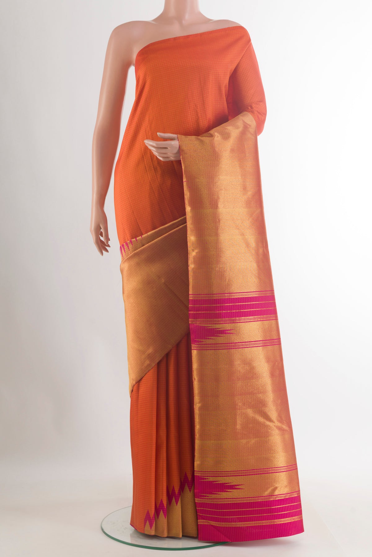 Pure Silk Orange Kanchipuram Saree with Checked design on the body and Temple Border.  displayed on a mannequin