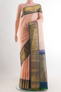 Rose pink Kanchipuram Silk Saree with Zari Butta on the body and Zari Border.  displayed on a mannequin