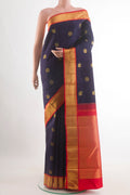 Navy Blue Kanchipuram Silk Saree with Zari Butta on the body and Zari Border.  displayed on a mannequin