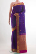 Purple Kanchipuram Silk Saree with Zari Butta on the body and Zari Border.  displayed on a mannequin