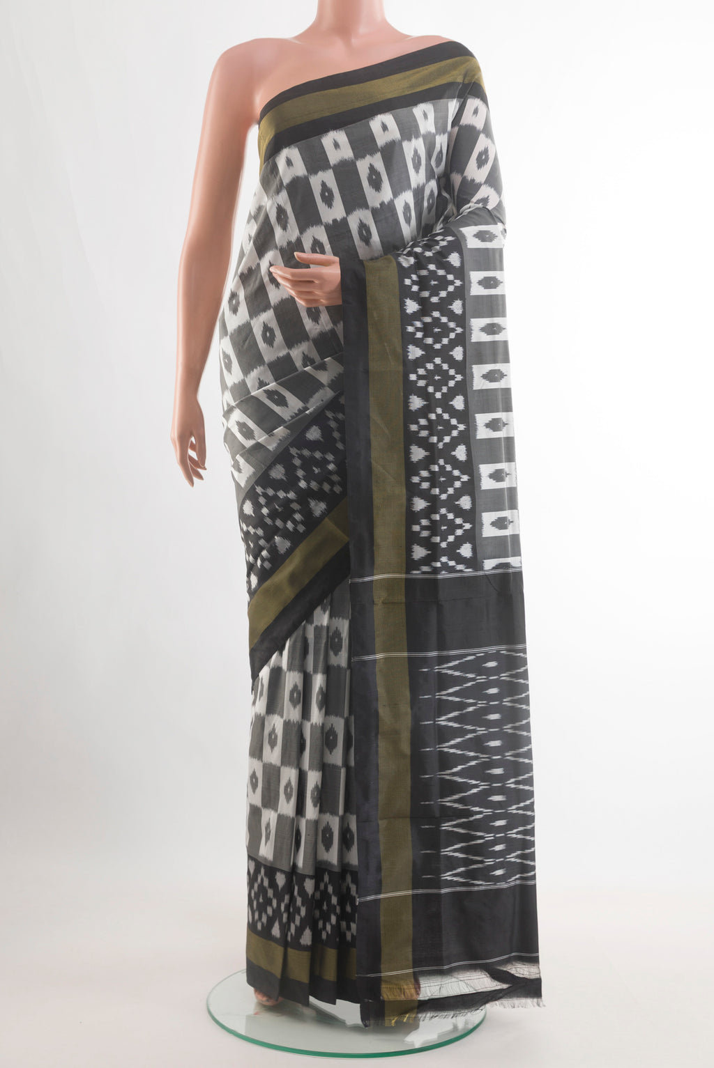 Grey Pochampally Silk Saree with Pure Ikat on the body and Zari Border.  displayed on a mannequin