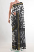 Grey Pochampally Silk Saree with Pure Ikat on the body and Zari Border.  displayed on a mannequin