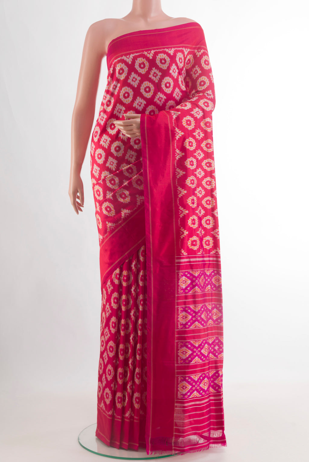 Pink Pochampally Silk Saree with Ikat design on the body and Plain Border.  displayed on a mannequin