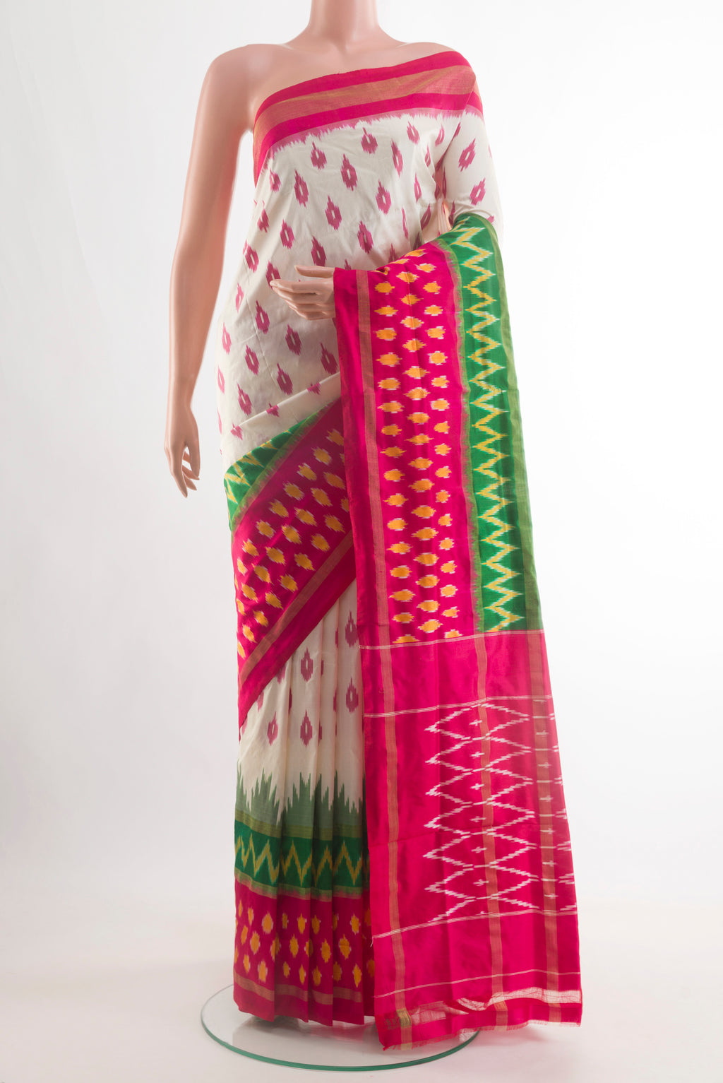 Off White Pochampally Silk Saree with Pure Ikat on the body and Ikat Border.  displayed on a mannequin