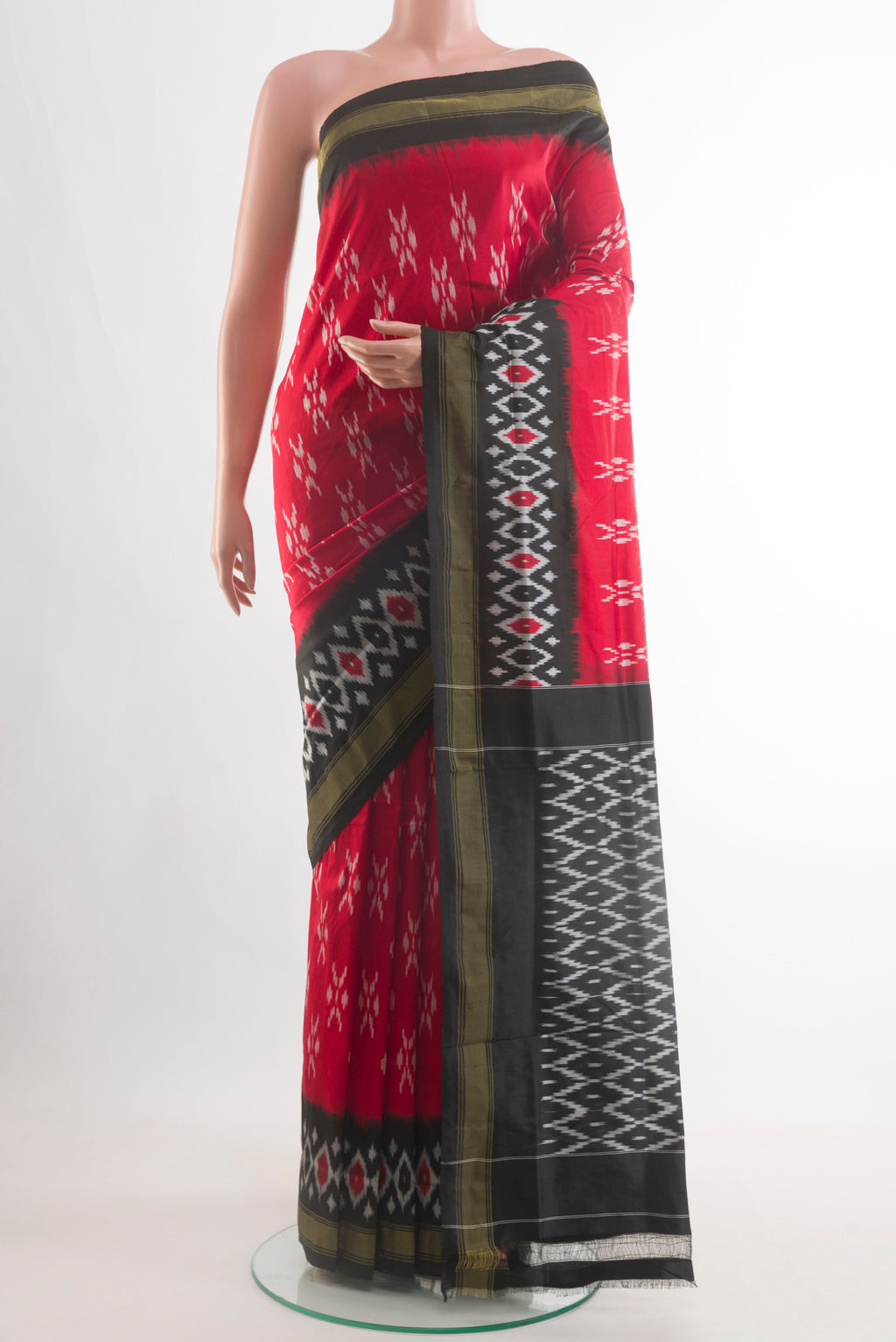 Red Pochampally Silk Saree with Pure Ikat on the body and Ikat Border.  displayed on a mannequin