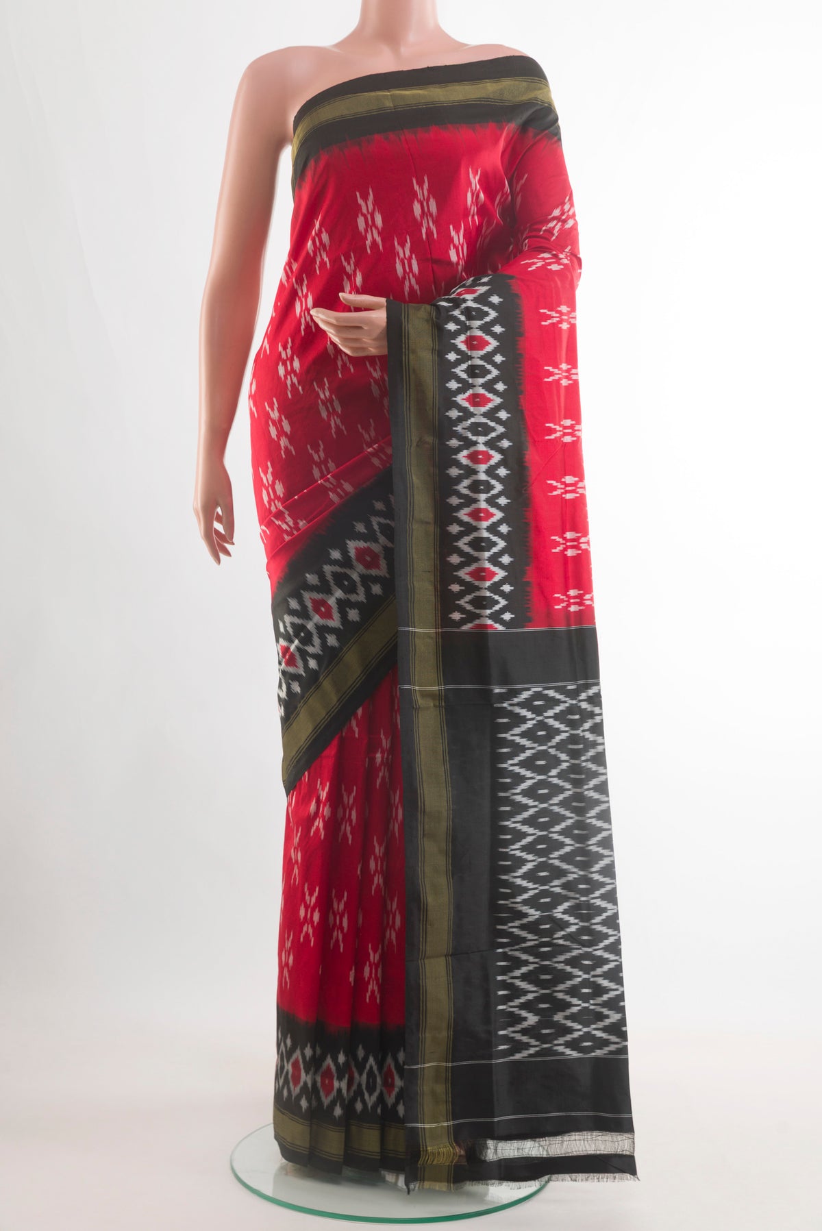 Red Pochampally Silk Saree with Pure Ikat on the body and Ikat Border.  displayed on a mannequin