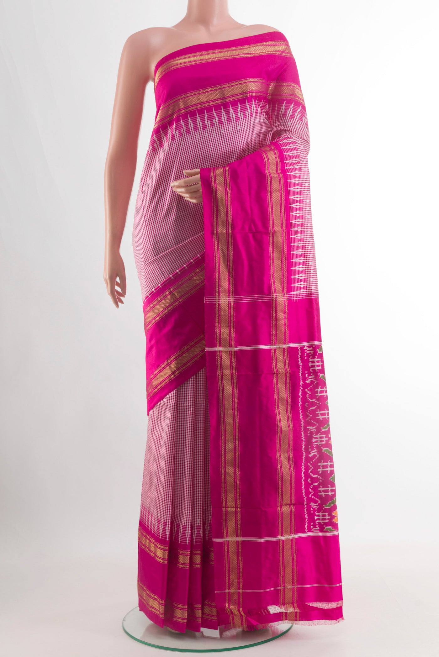 Pink Pochampally Silk Saree with Checked design on the body and Zari Border.  displayed on a mannequin