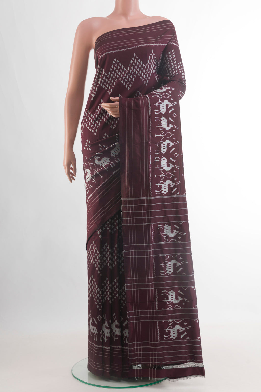 Brown Pochampally Silk Saree with Ikat design on the body and Plain Border.  displayed on a mannequin