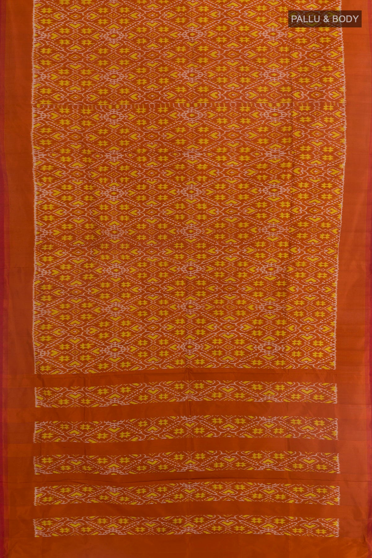 Flat view of Rust Pochampally Silk Saree with Ikat design on the body and Plain Border. 