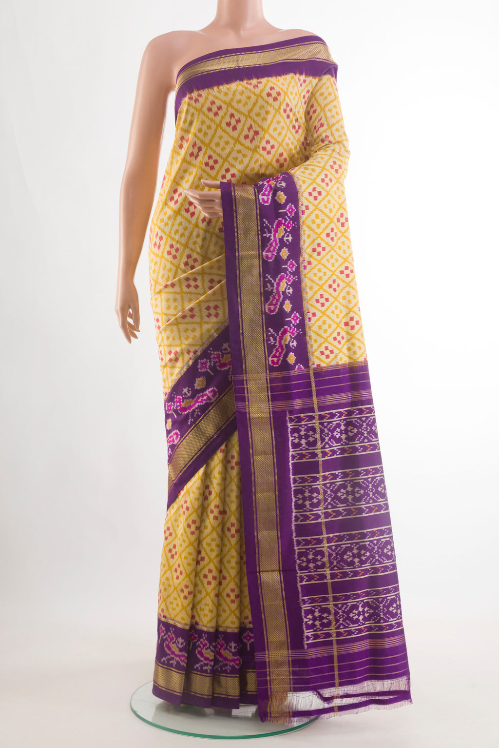 Yellow Pochampally Silk Saree with Pure Ikat on the body and Ikat Border.  displayed on a mannequin