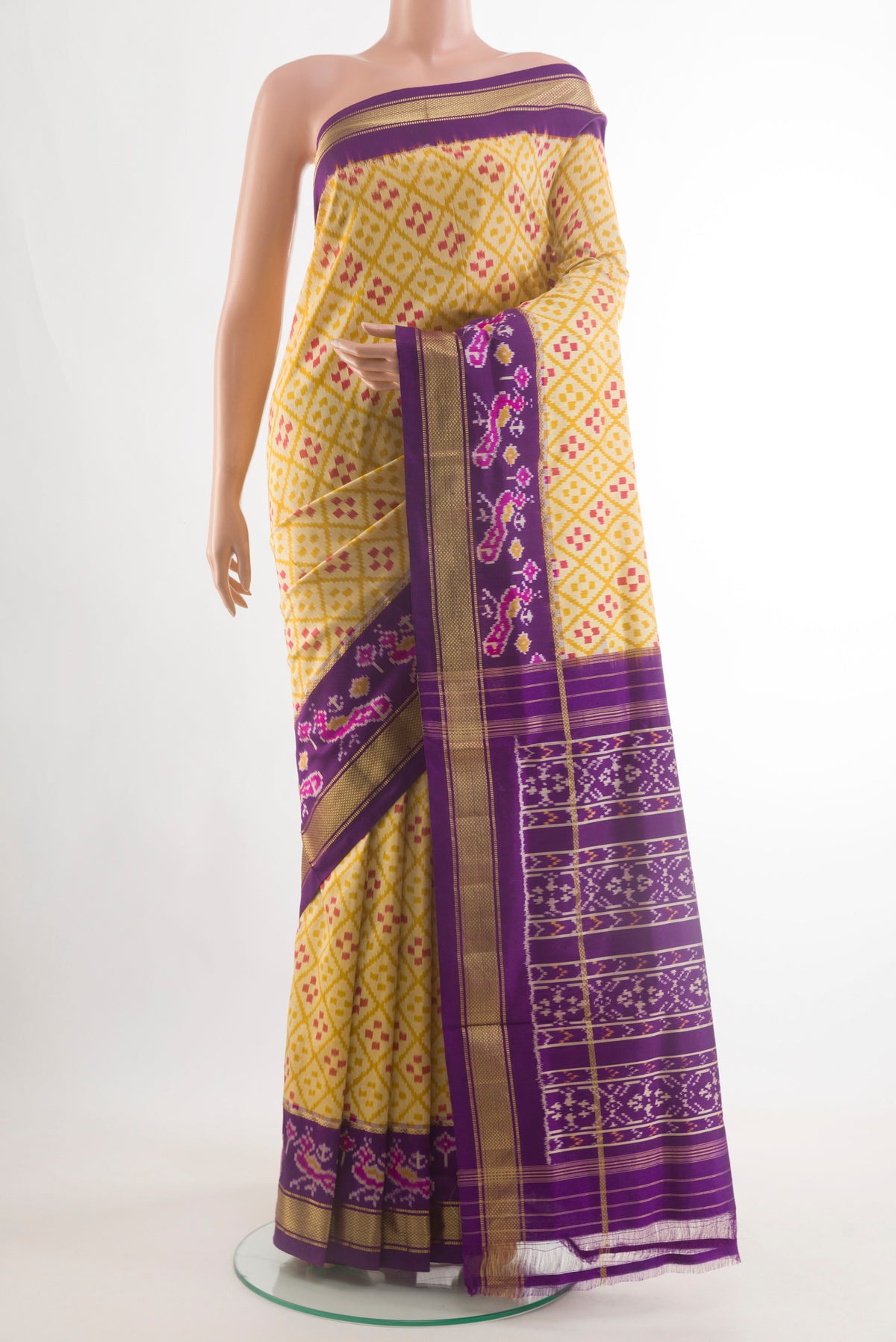 Yellow Pochampally Silk Saree with Pure Ikat on the body and Ikat Border.  displayed on a mannequin