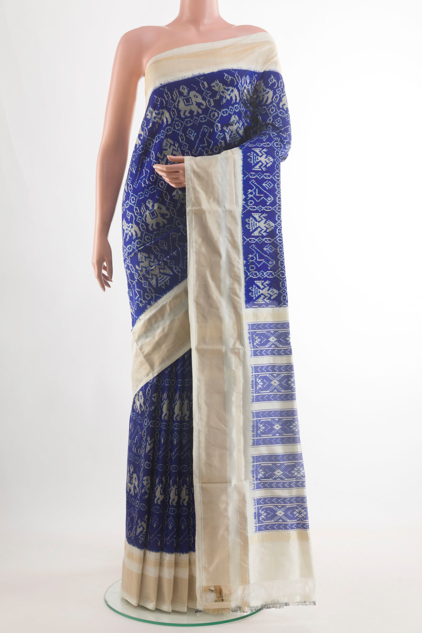 Blue Pochampally Silk Saree with Pure Ikat on the body and Zari Border.  displayed on a mannequin