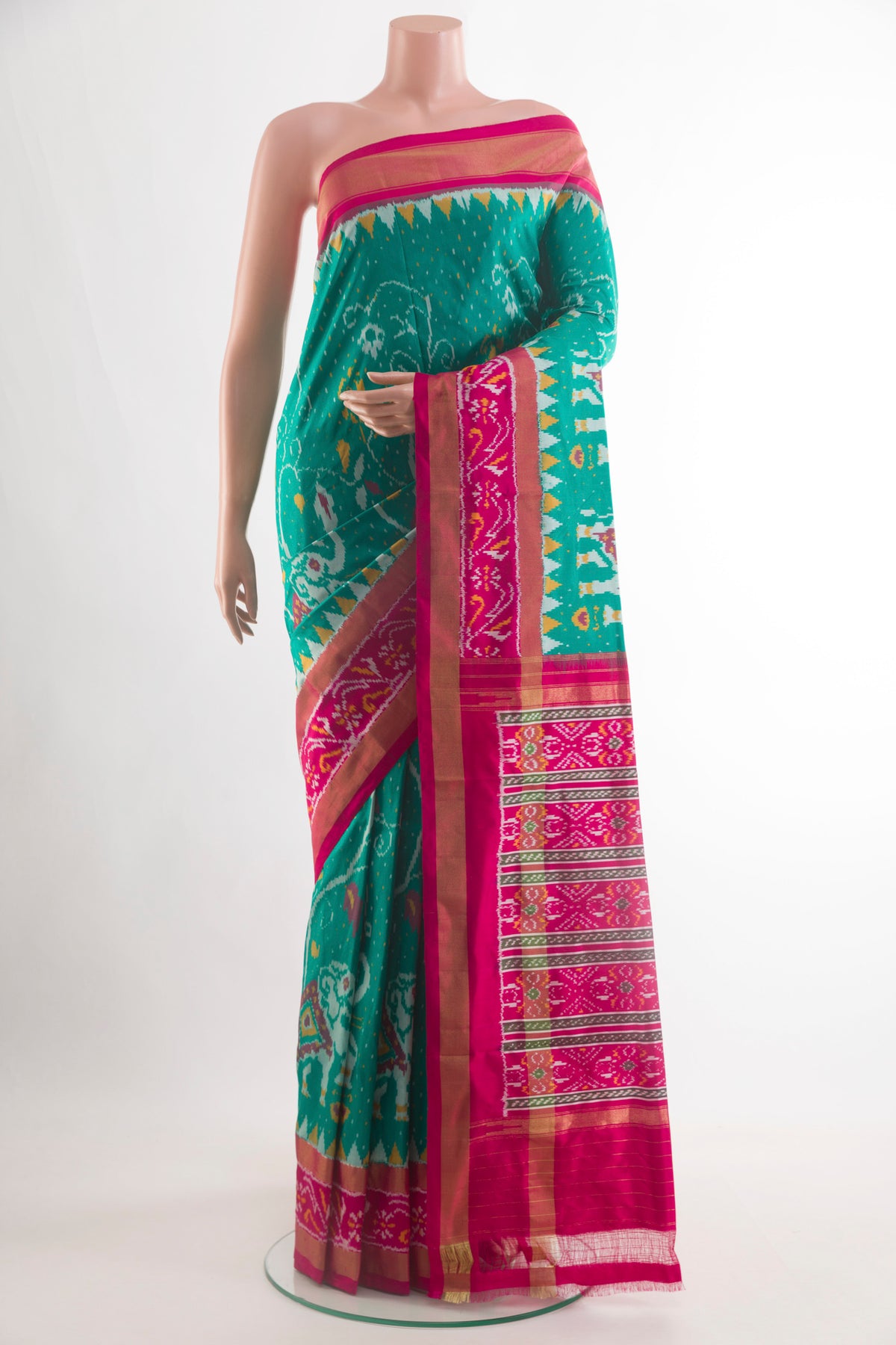 Sea Green Pochampally Silk Saree with Pure Ikat on the body and Zari Border.  displayed on a mannequin