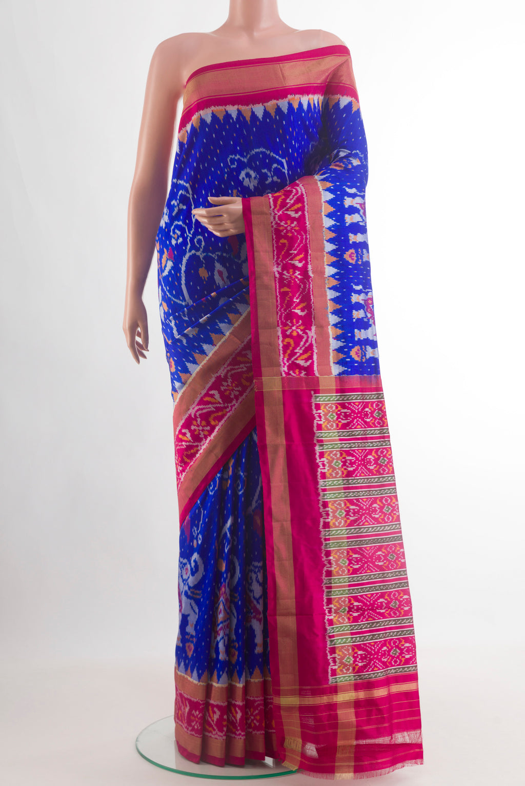 Royal Blue Pochampally Silk Saree with Ikat design on the body and Zari Border.  displayed on a mannequin