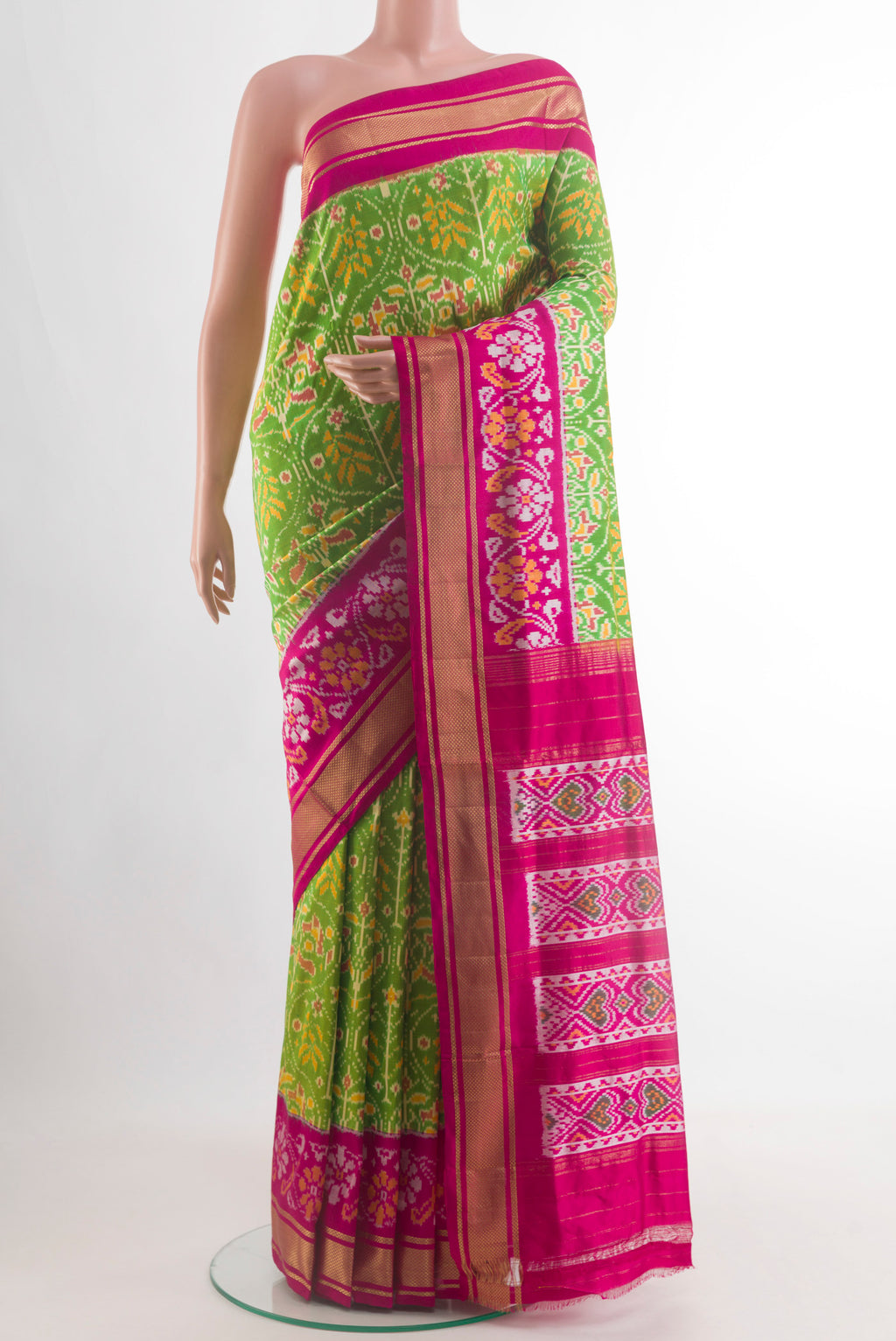 Parrot Green Pochampally Silk Nine Yards Saree with Ikat design on the body and Zari Border.  displayed on a mannequin