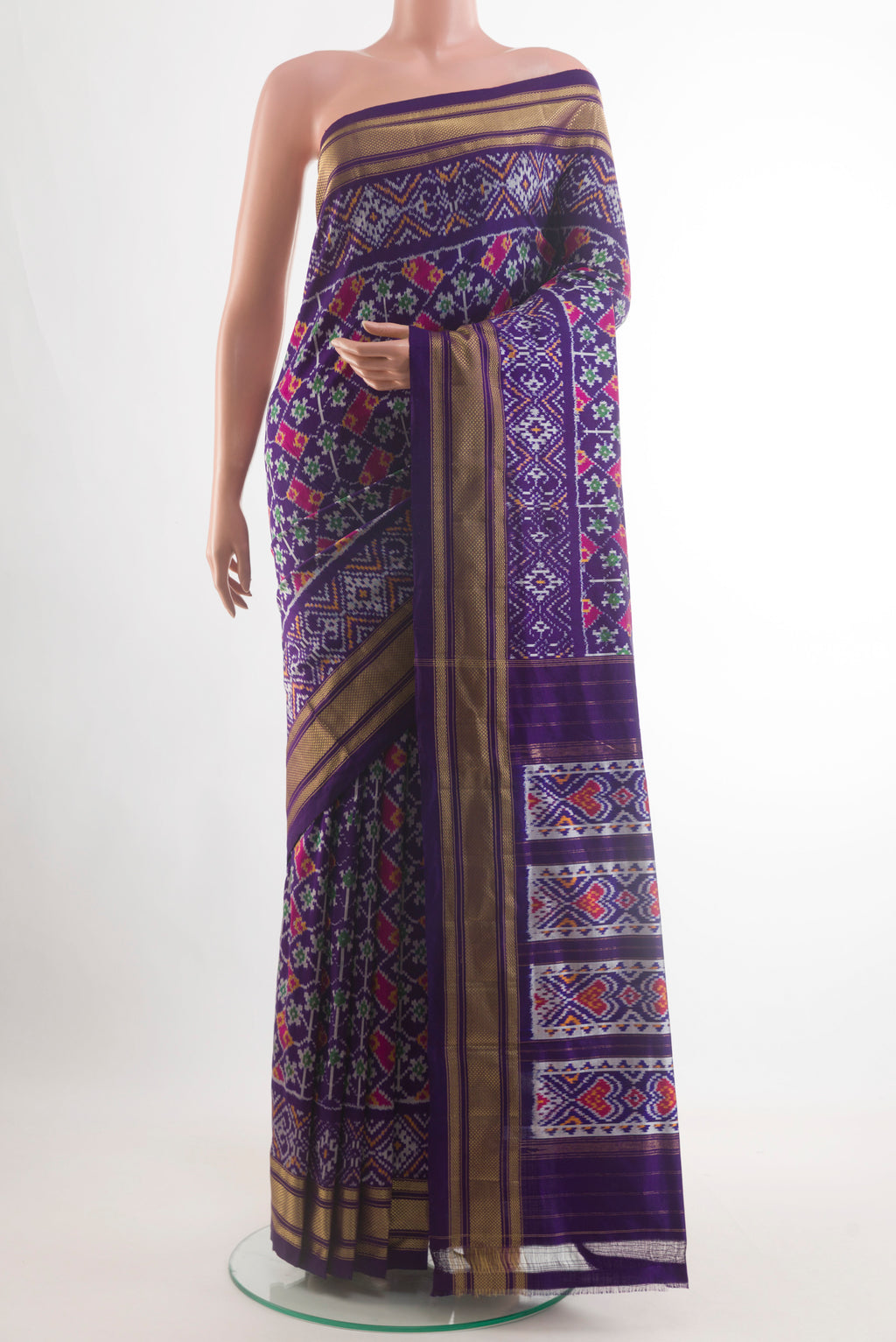 Violet Pochampally Silk Saree with Pure Ikat on the body and Ikat Border.  displayed on a mannequin