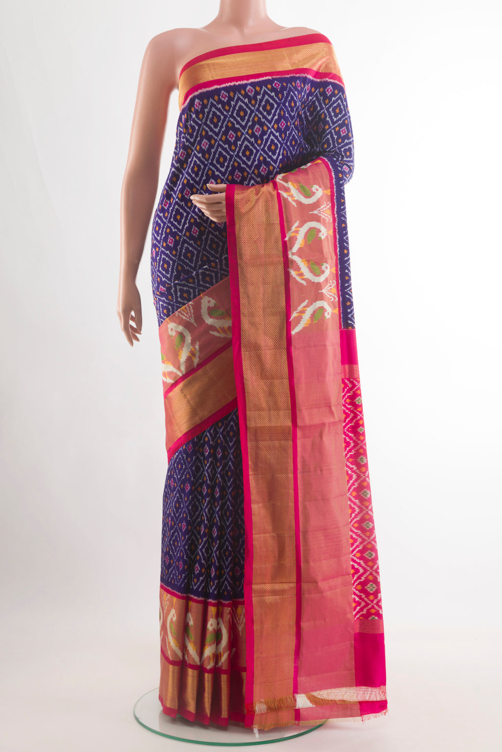 Dark Blue Pochampally Silk Saree with Pure Ikat on the body and Zari Border.  displayed on a mannequin
