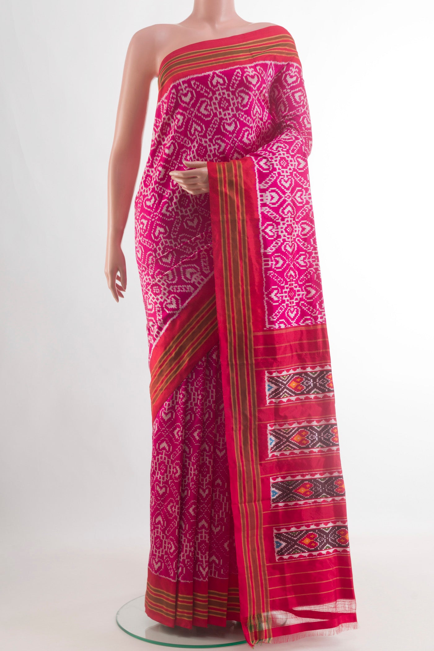 Pink Pochampally Silk Saree with Ikat design on the body and Plain Border.  displayed on a mannequin