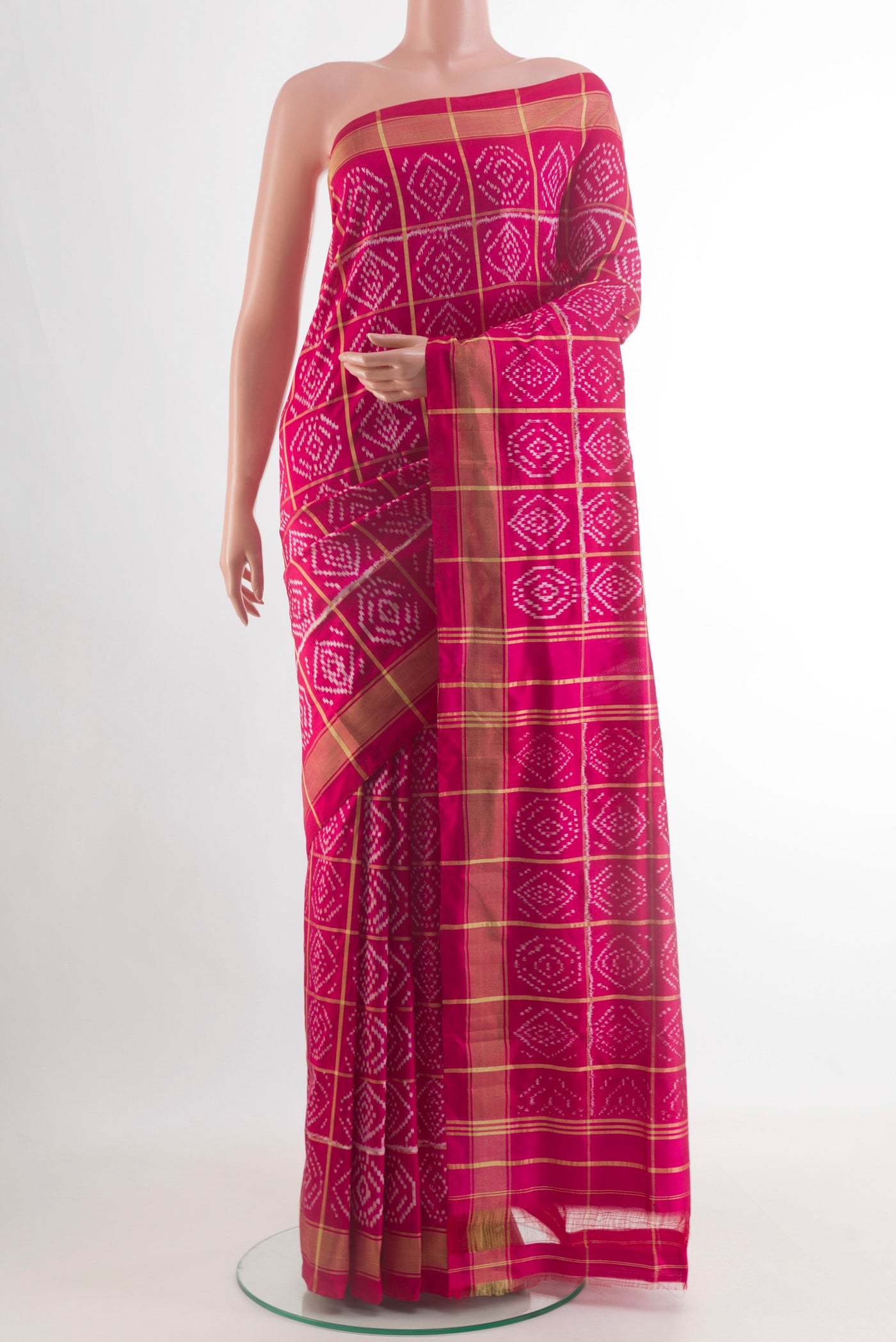 Pink Pochampally Silk Saree with Ikat design on the body and Zari Border.  displayed on a mannequin