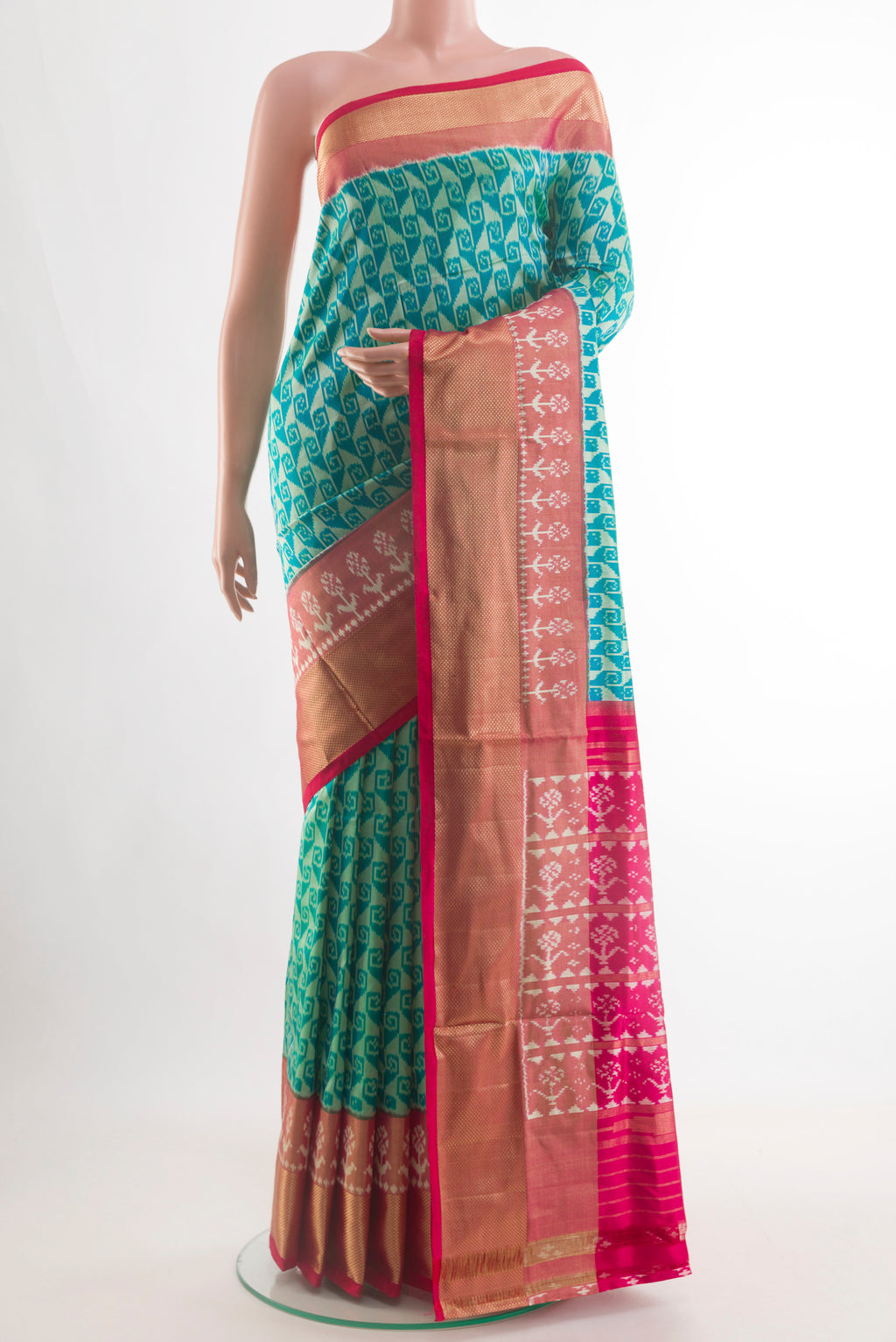 Sea Green Pochampally Silk Saree with Pure Ikat on the body and Zari Border.  displayed on a mannequin