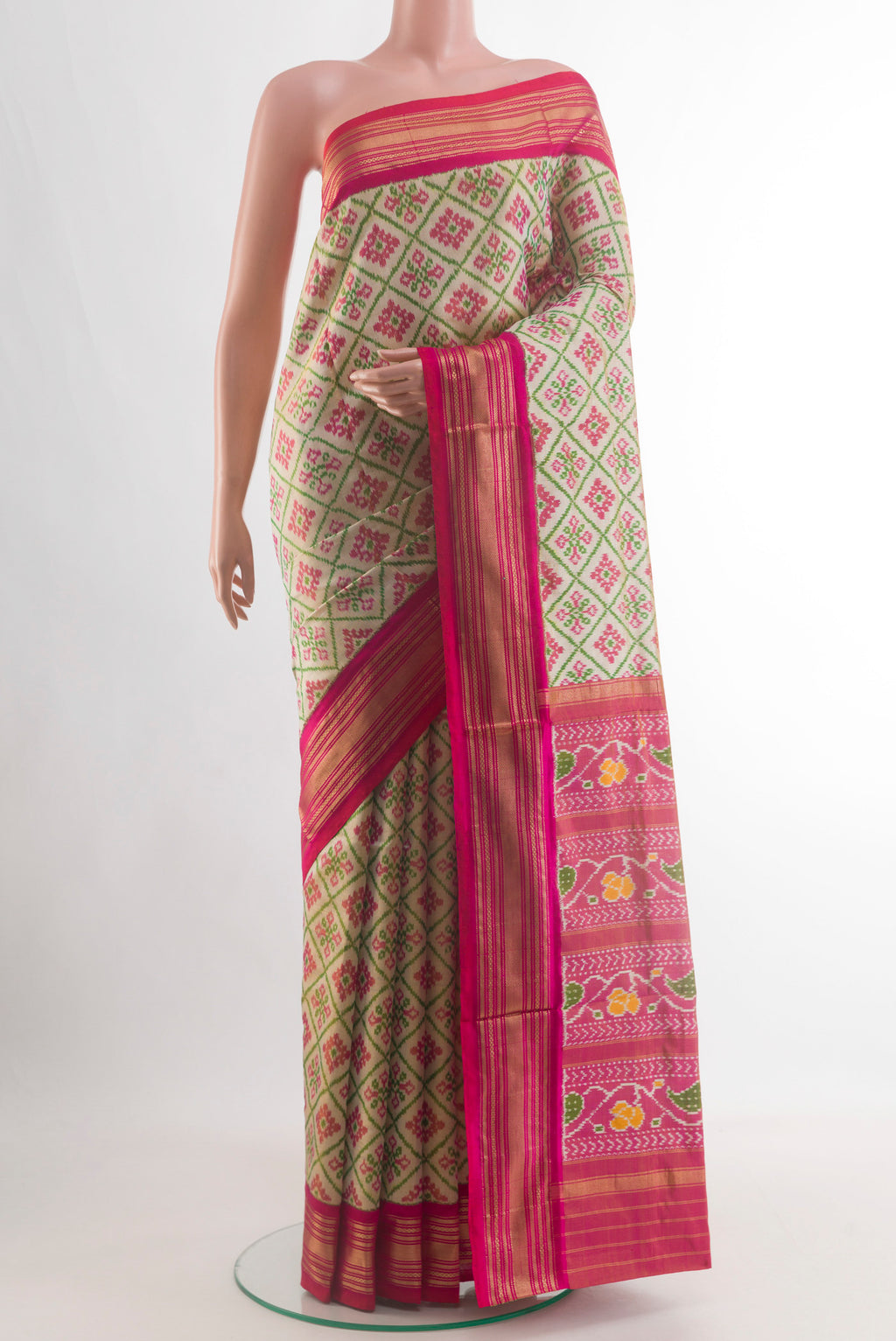 Beige Pochampally Silk Saree with Ikat design on the body and Zari Border.  displayed on a mannequin