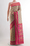 Beige Pochampally Silk Saree with Ikat design on the body and Zari Border.  displayed on a mannequin