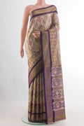 Off White Pochampally Silk Saree with Ikat design on the body and Zari Border.  displayed on a mannequin