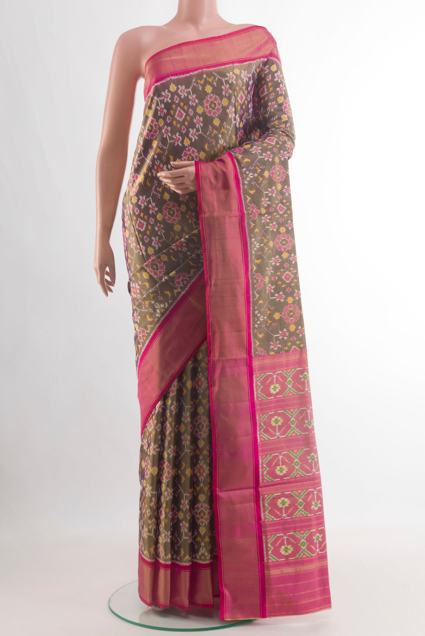 Purple Pochampally Silk Saree with Ikat design on the body and Zari Border.  displayed on a mannequin