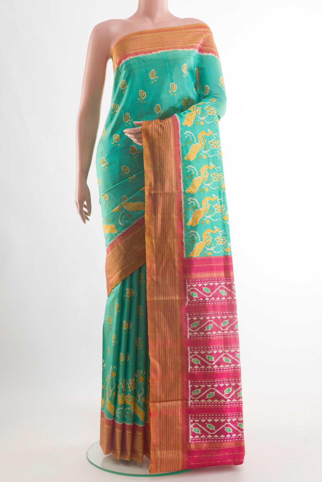Sea Green Pochampally Silk Saree with Pure Ikat on the body and Zari Border.  displayed on a mannequin