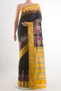 Black Pochampally Silk Saree with Plain Body and Ikat Border.  displayed on a mannequin
