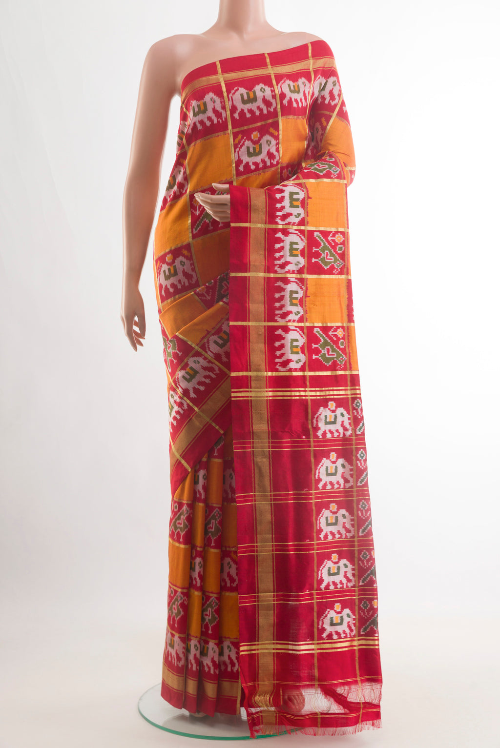 Multi Color Pochampally Silk Saree with Checked design on the body and Zari Border.  displayed on a mannequin