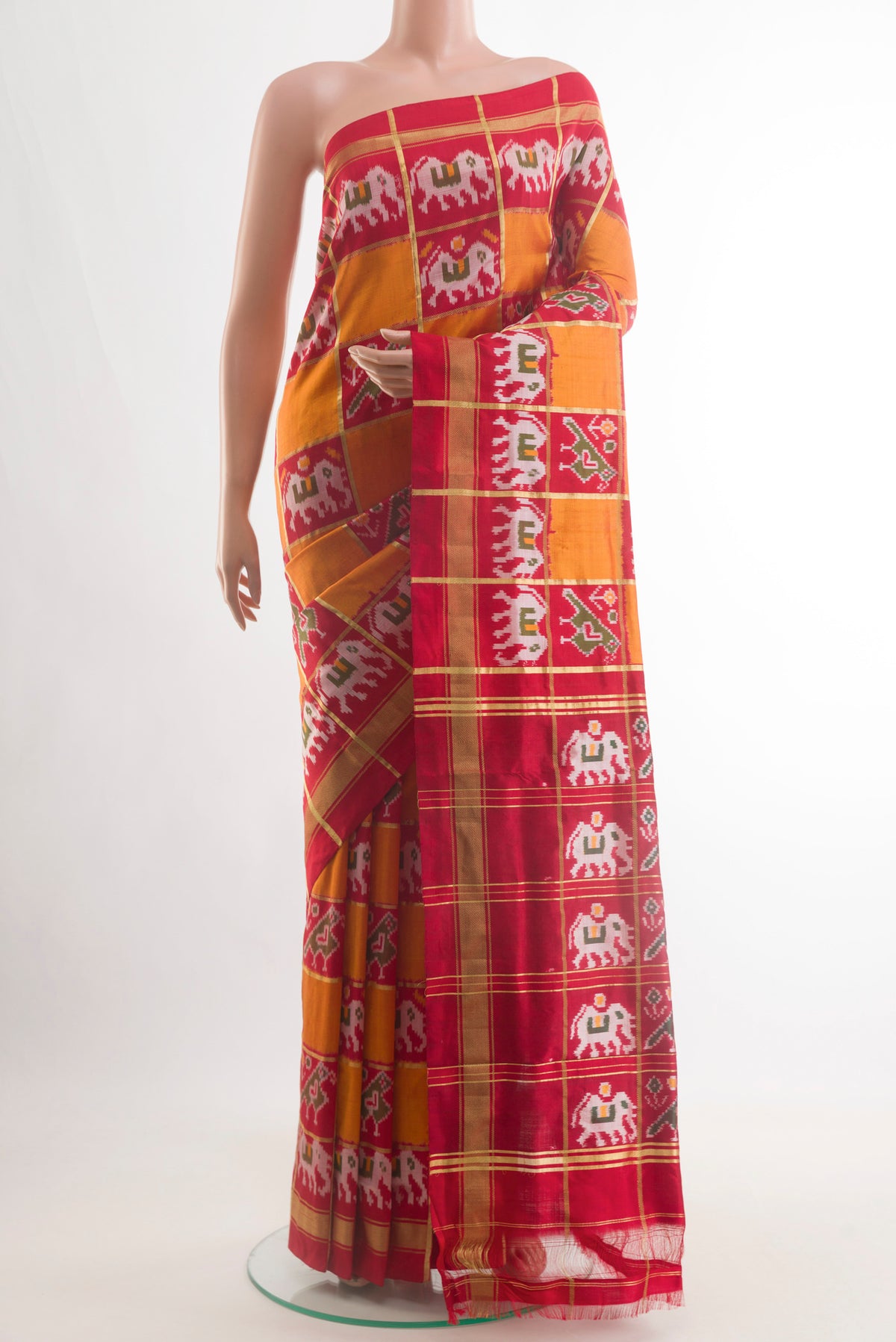 Multi Color Pochampally Silk Saree with Checked design on the body and Zari Border.  displayed on a mannequin